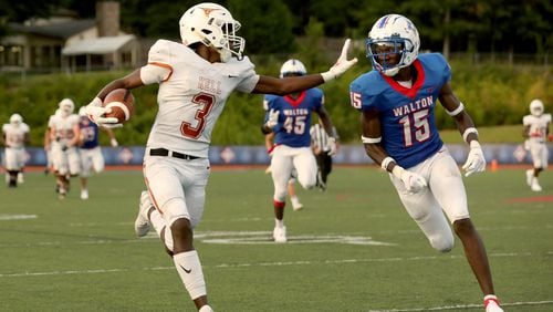 Kell wide receiver Jaylon Brown (3) runs after a catch against Walton defensive back Marcus Allen (15) in the second half at Walton high school Friday, September 4, 2020 in Marietta, Ga.. This is one of several football games during the 2020 Corky Kell Classic. (Jason Getz/Special to the AJC)