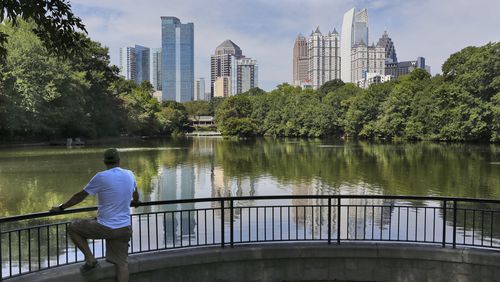 Charlie Saye took in the great view of midtown at Piedmont Park's Lake Clara Meer Friday.