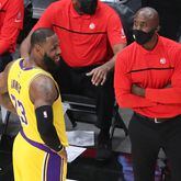 Hawks, Lakers meet at State Farm Arena: Hawks head coach Lloyd Pierce and Lakers star LeBron James share a light moment during Monday's game in Atlanta.