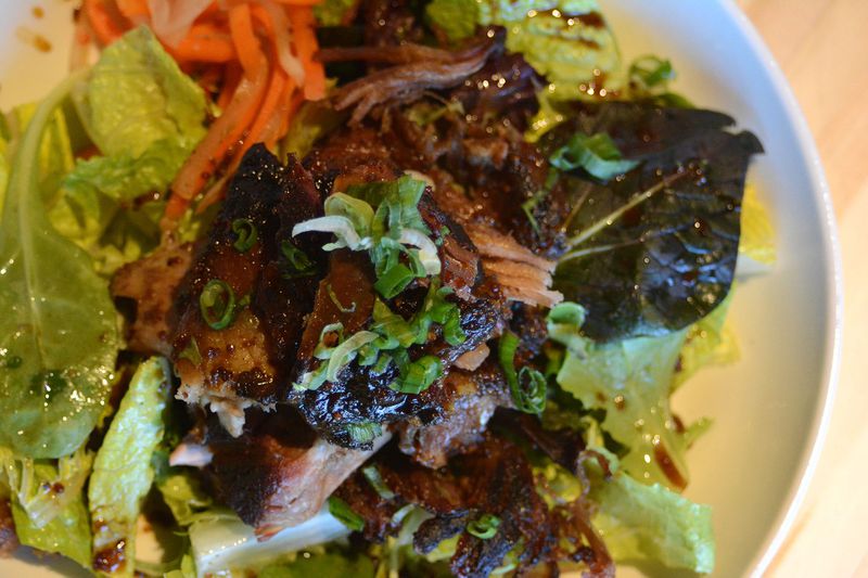 Pulled pork salad with field greens at Smoke and Duck Sauce. STYLED BY CHEF JOE CHIN LOY; CONTRIBUTED BY ADRIENNE HARRIS