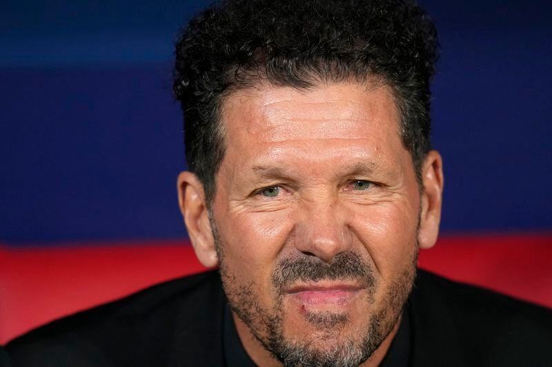 Atletico Madrid's head coach Diego Simeone waits for the start of the Champions League quarterfinal soccer match between Atletico Madrid and Borussia Dortmund at the Metropolitano stadium in Madrid, Spain, Wednesday, April 10, 2024. (AP Photo/Manu Fernandez)