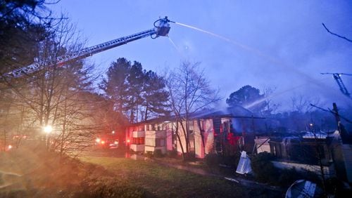 One resident was injured in a predawn apartment fire near at the Brannon Hills complex Feb. 19, 2014. A judge is authorizing demolition of four burned-down buildings at the complex. JOHN SPINK / AJC