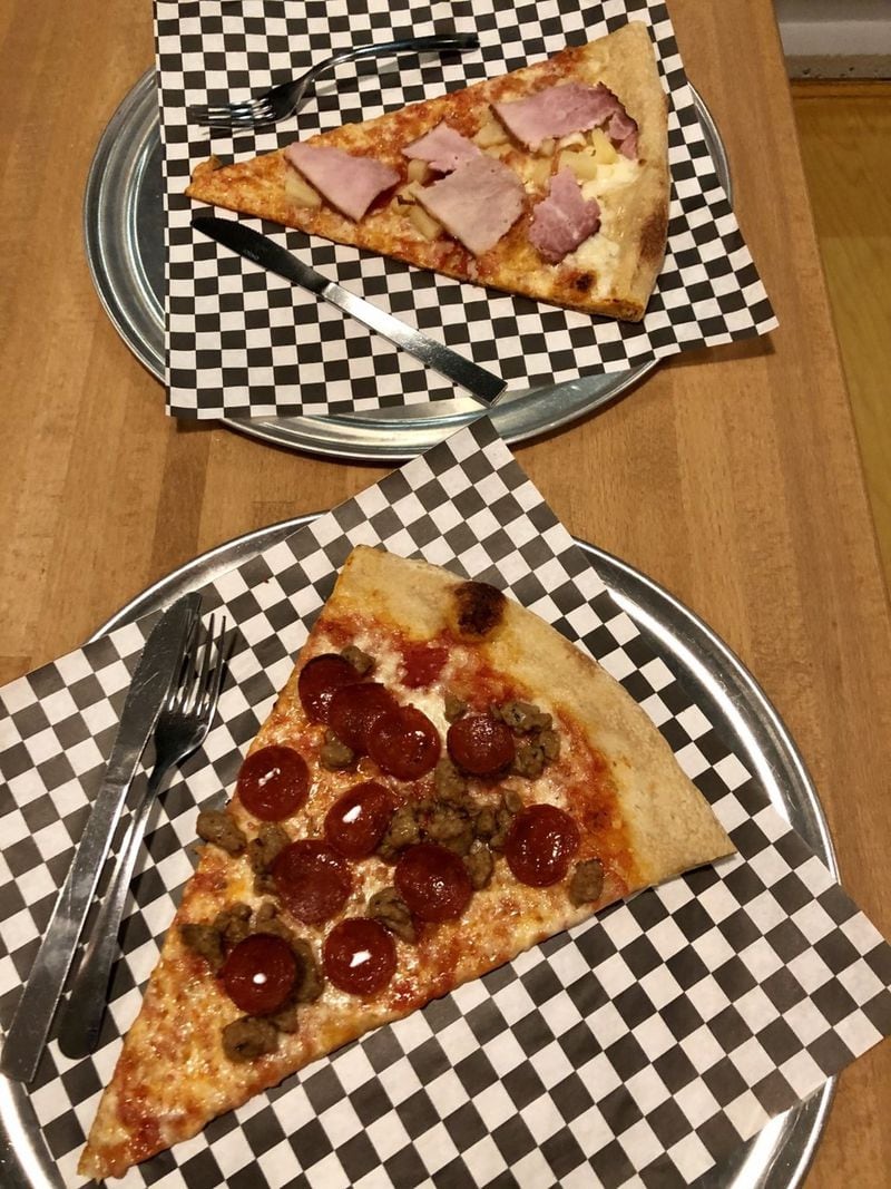 Junior’s Pizza has toppings to suit your tastes, whether you prefer a slice with ham and pineapple (top) or one with Italian sausage and pepperoni (bottom). CONTRIBUTED BY WENDELL BROCK