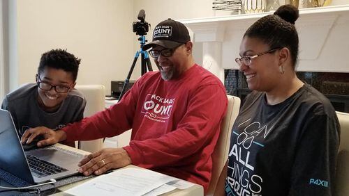 Educating and engaging their son are Kenny and Tracy Braswell filling out the 2020 U.S. Census. (Left: KJ, Kenny and wife Tracy). Photo contributed.