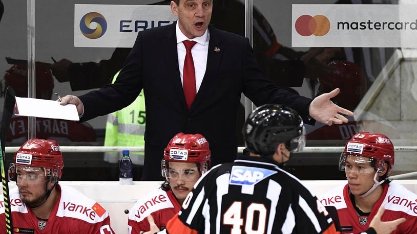 In any country and any language, a coach's exasperation is the same. Here Curt Fraser reacts during a Kontinental Hockey League game between CSKA Moscow and Kunlun Red Star in Moscow. (Vladimir Astapkovich / Sputnik  via AP)