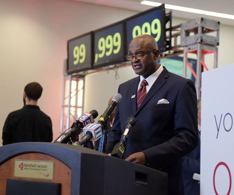 DECEMBER 27, 2015 ATLANTA Airport Manager Miguel Southwell gives remarks during the ceremony. Hartsfield-Jackson International Airport awarded its 100 millionth passenger for 2015 with prizes including a new car, two free airline tickets and a small crowd of officials and television cameras early Sunday December 27, 2015. The Atlanta airport — the world’s busiest — is the first airport in the world to handle 100 million passengers in a year. “It’s our commitment that we maintain our position as the world’s most traveled airport,” said Atlanta Mayor Kasim Reed during remarks at the airport before the flight arrived Sunday morning. The winner, a man from Biloxi named Larry Kendrick who arrived at the airport in blue jeans, an orange t-shirt and a baseball cap, was surprised to learn upon landing that he had been selected as the 100 millionth passenger. KENT D. JOHNSON/ kdjohnson@ajc.com