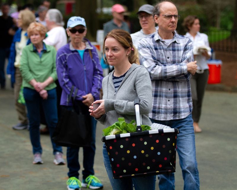 Steffi Zimmer Stands in line for her fresh bread at the Carter Center Farmers Market Saturday, March 28, 2020.   STEVE SCHAEFER / SPECIAL TO THE AJC