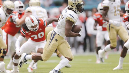 Jordan Mason #27 of the Georgia Tech Yellow Jackets runs with the ball against the Miami Hurricanes during the first half at Hard Rock Stadium on October 19, 2019 in Miami, Florida. (Photo by Michael Reaves/Getty Images)