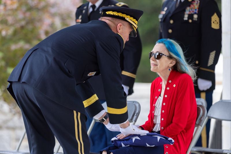 Medal of Honor recipient Luther Story’s niece, Judy Wade, received the flag covering Story's casket. Story was reinterred with military honors at Andersonville National Cemetery on Memorial Day, Monday, May 29, 2023. The Korean War hero was initially unidentified and buried as an unknown soldier at the National Memorial Cemetery of the Pacific in Honolulu. (Arvin Temkar / arvin.temkar@ajc.com)