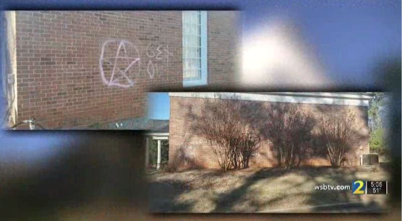 The spray-painted symbols include a pentagram with the words “get out” as well as lewd graffiti, police said.