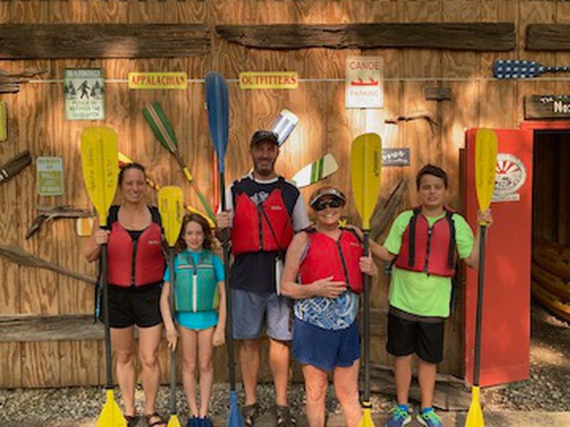 Ready to hit the water, and enjoy some quality time kayaking (from left) Wendy Cocke, Lily Cocke, Andy Cocke, Kathy Anderson and AJ Cocke secure their lifejackets and grab some paddles.