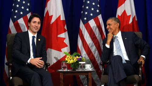 FILE - In this Nov. 19, 2015 file photo, President Barack Obama listens as Canada's Prime Minister Justin Trudeau speaks during a bilateral meeting in Manila, Philippines.  Trudeau is tweeting his thanks to former U.S. President Barack Obama after the two shared a private dinner at a Montreal restaurant, Tuesday, June 6, 2017. Trudeau posted a picture of the pair talking in the eatery, with the caption, "How do we get young leaders to take action in their communities? Thanks BarackObama for your visit & insights tonight in my hometown.''  (AP Photo/Susan Walsh, File)