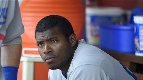 This July 21, 2016 file photo shows Los Angeles Dodgers' Yasiel Puig looking on from the dugout during a baseball game against the Washington Nationals in Washington. (AP Photo/Nick Wass)