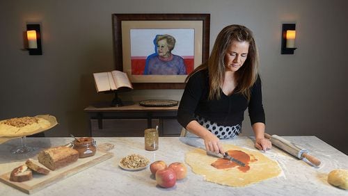 Josephine Caminos Oria of O'Hara spreads dulce de leche over crostata dough. (Nate Guidry/Pittsburgh Post-Gazette/TNS)