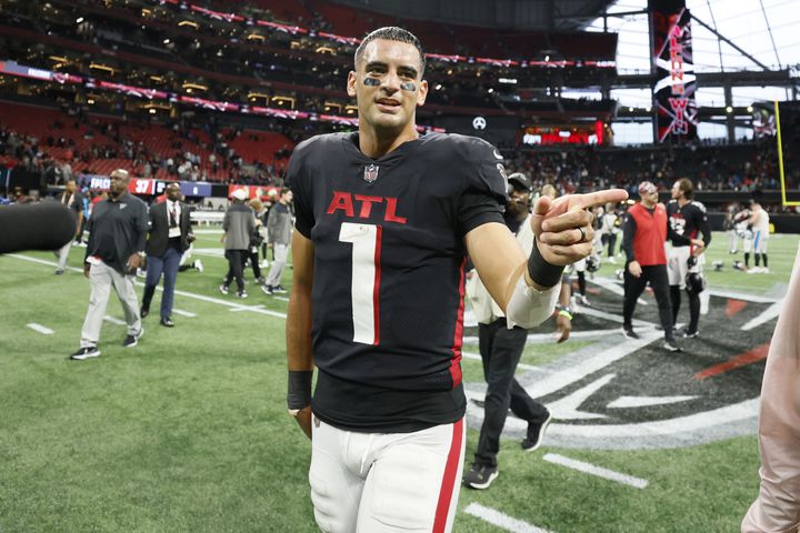 Falcons quarterback Marcus Mariota walks off the field after an overtime victory. The Falcons defeated the Panthers 37-34. (Miguel Martinez / miguel.martinezjimenez@ajc.com)