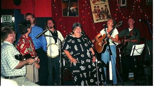 Joyce Brookshirelaughs at the Red Light Cafe, along with Atlanta musicians Mick Kinney, Kathleen Hatfield, L.A. Tuten, Jeff Mosier, Elise Witt, and Johnny Mosier.