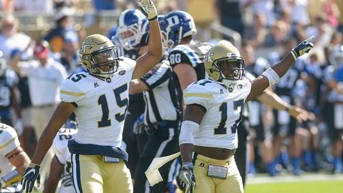 Sophomore DB A.J. Gray (15) and junior DB Lance Austin (17) signal a turnover after a play in the first half of Georgia Tech’s 38-35 win over Duke Saturday, October 29, 2016. SPECIAL/Daniel Varnado