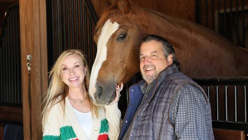 Deborah and Eric Wilhelm stand with their horse, Fantinel, at their Del Cavallo Farm in Marietta. PHIL SKINNER FOR THE ATLANTA JOURNAL-CONSTITUTION