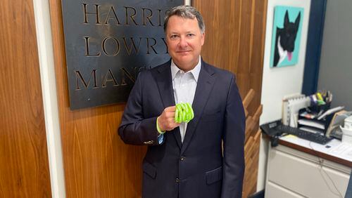 Jeff Harris, a founding partner at Harris Lowry Manton LLP, holds some of the green bracelets that Banded Together is distributing in an effort to decrease COVID-19 vaccine hesitancy. Courtesy of Banded Together