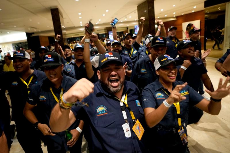 Supporters of Achieving Goals presidential candidate Jose Raul Mulino celebrate early results after the closing of polls for general elections in Panama City, Sunday, May 5, 2024. (AP Photo/Matias Delacroix)