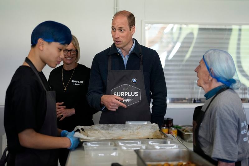 Britain's Prince William meets workers during a visit to Surplus to Supper, in Sunbury-on-Thames, Surrey, England, Thursday, April 18, 2024. The Prince visited Surplus to Supper, a surplus food redistribution charity, to learn about its work bridging the gap between food waste and food poverty across Surrey and West London. (AP Photo/Alastair Grant, pool)