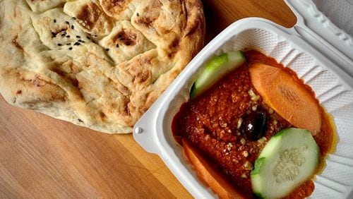 Truva's muhammara, a dip of ground walnuts and roasted red peppers, is incredibly addictive. Henri Hollis/henri.hollis@ajc.com