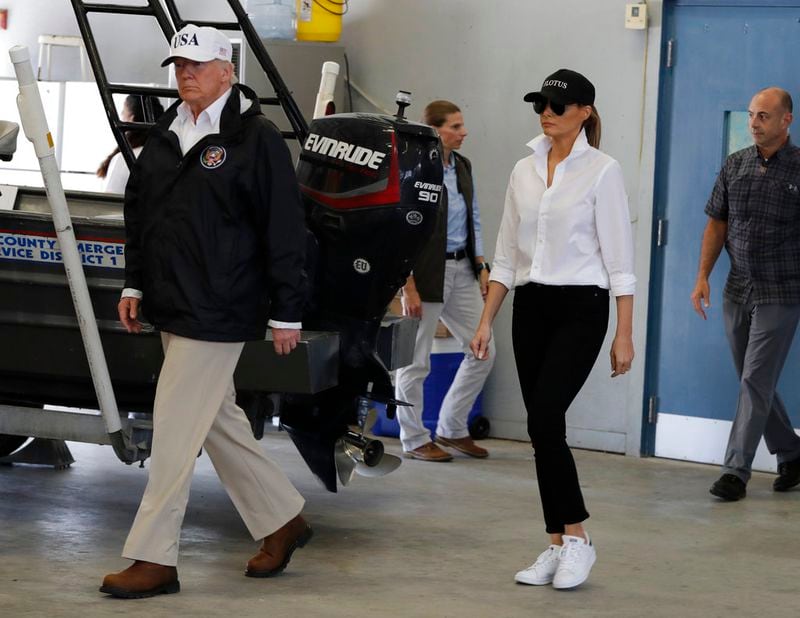 President Donald Trump and first lady Melania Trump arrive take part in a briefing on Harvey relief efforts, Tuesday, Aug. 29, 2017, at Firehouse 5 in Corpus Christi, Texas. (AP Photo/Evan Vucci)