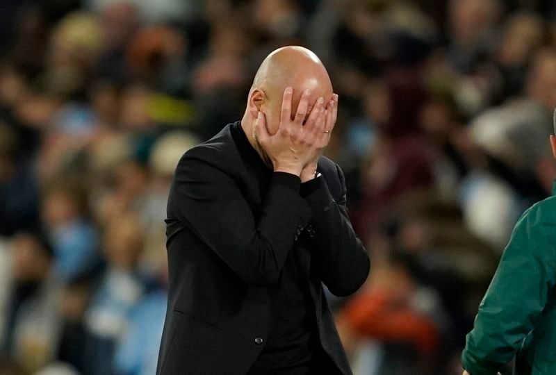 Manchester City's head coach Pep Guardiola reacts during the Champions League quarterfinal second leg soccer match between Manchester City and Real Madrid at the Etihad Stadium in Manchester, England, Wednesday, April 17, 2024. (AP Photo/Dave Thompson)