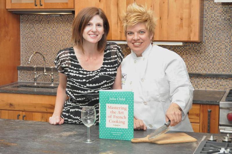 Owner Cyndi Sterne and Chef Jessica Ray in Hal's Kitchen, which teaches everything from kitchen basics to cooking specialty meals.