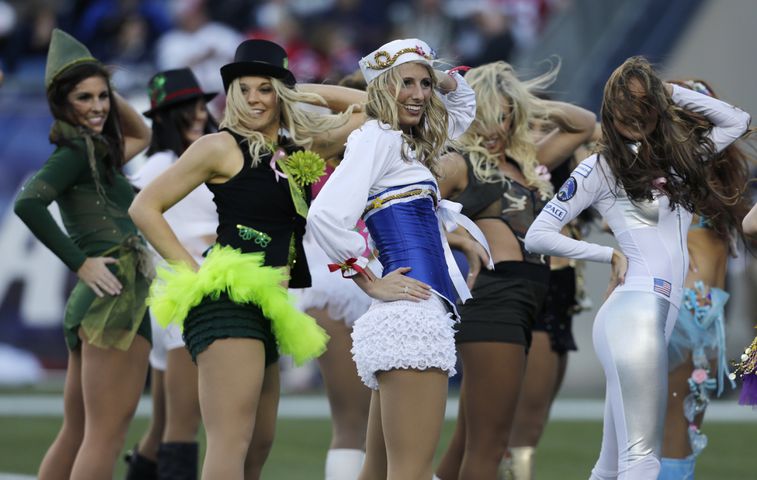 Cheerleaders take to the field in costumes