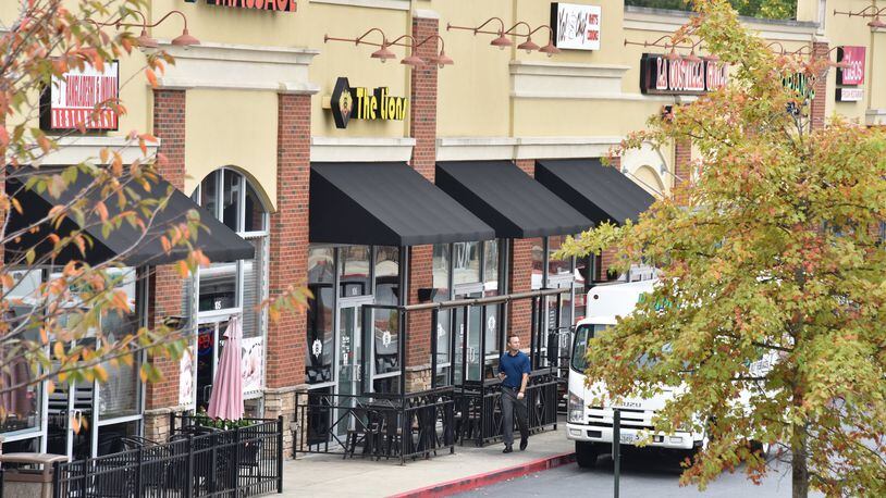 The Lions Restaurant and Hookha Lounge in the Crossroads Village shopping center is surrounded by other international businesses. (Hyosub Shin / Hyosub.Shin@ajc.com)