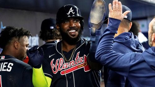 Marcell Ozuna is well-liked in the Atlanta clubhouse, and his Braves teammates had a big celebration for Ozuna Tuesday after he reached a milestone in major-league service.