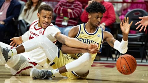 Arkansas’ Daniel Gafford goes for a loose ball against Georgia Tech’s Khalid Moore Wednesday, Dec. 19, 2018, at Bud Walton Arena in Fayetteville, Ark.