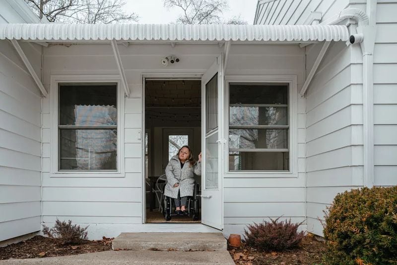 Voorde poses near the entrance of her home in South Bend, Indiana. (Photo Courtesy of Jamie Kelter Davis, The 19th)