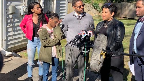 The Savage family - from left, Jailyn, Jori, Timothy and Jonjelyn  - along with lawyer Gerald Griggs (far right), met with the press on Wednesday morning to talk about their daughter, Joycelyn, whom they haven't seen in the two years since she's been with R. Kelly.