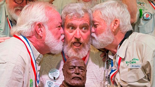 Dave Hemingway (center) receives kisses from Charlie Boise (left) and Wally Collins after Hemingway won the 2016 Ernest Hemingway look-alike contest at Hemingway Days 2016 in Key West. (Dave Hemingway is not related to Ernest Hemingway.) CONTRIBUTED BY ROB O’NEAL, FLORIDA KEYS NEWS BUREAU