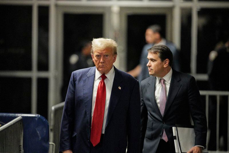 Former President Donald Trump walks outside the courtroom of his trial at Manhattan criminal court, Tuesday, April 30, 2024, in New York. His attorney, Todd Blanche, is on the right. (Curtis Means/Pool Photo via AP)