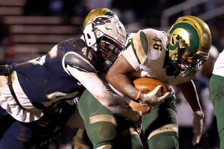 Dec. 18, 2020 - Norcross, Ga: Grayson running back Sean Downer (46) runs against Norcross defensive end Myles Allen (46) in the second half of the Class AAAAAAA semi-final game at Norcross high school Friday, December 18, 2020 in Norcross, Ga.. JASON GETZ FOR THE ATLANTA JOURNAL-CONSTITUTION