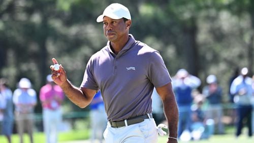 Tiger Woods reacts to making a putt for par on 17th green during second round of the 2024 Masters Tournament at Augusta National Golf Club, Friday, April 12, 2024, in Augusta, Ga. (Hyosub Shin / Hyosub.Shin@ajc.com)