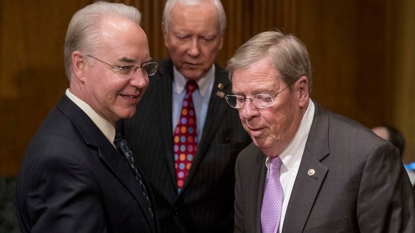 Health and Human Services Secretary nominee Tom Price, R-Ga., left, arrives with Senate Finance Committee Chairman Sen. Orrin Hatch, R-Utah, center, and Sen. Johnny Isakson, R-Ga., on Capitol Hill at Price’s confirmation hearing in January. AP/Andrew Harnik