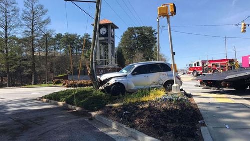 Cobb Parkway is closed in both directions near SunTrust Park after a driver slammed into a power pole, Smyrna police said.