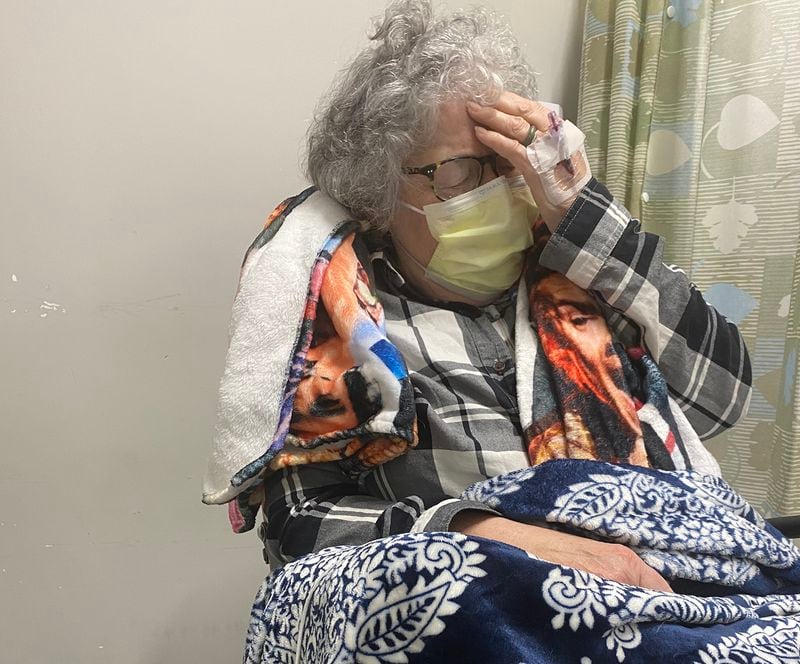 Susan Oliviero spent her 81st birthday in a waiting area at Emory University Hospital, suffering from body aches and a sore throat brought on by COVID. “It feels like it’s on fire,” she said at the time.  (Helena Oliviero / helena.oliviero@ajc.com)