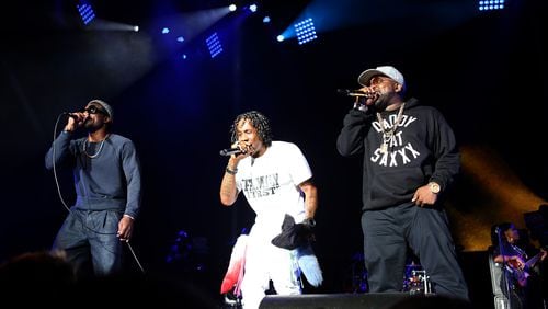 The highlight of One Musicfest was the reunion of Outkast, shown with Goodie Mob's Big Gipp (center). (Akili-Casundria Ramsess/Special to the AJC)