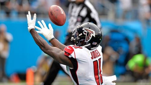 Falcons wide receiver Julio Jones tries  for the ball against the Panthers in the fourth quarter Sunday at Bank of America Stadium in Charlotte, N.C.