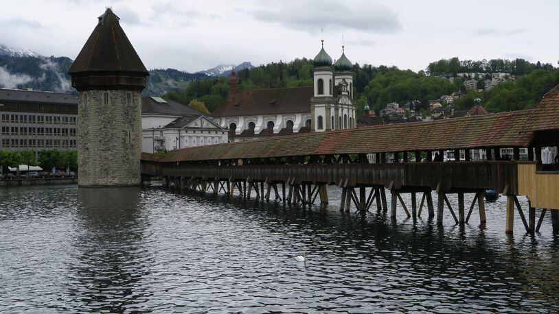 One of Lucerne’s most iconic site is the Kapellbrucke, a covered wooden footbridge over the Reuss. (Liza Weisstuch/TNS)