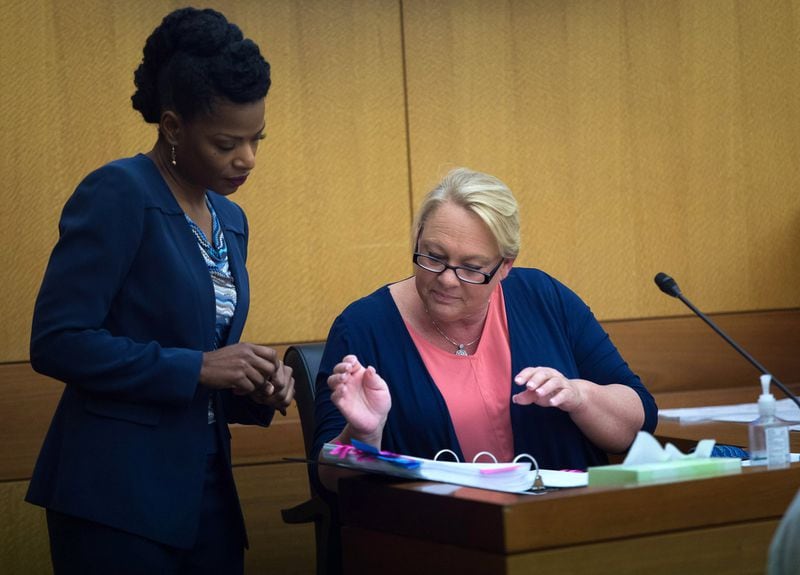 Fulton County Deputy District Attorney Melissa Redmon (left) asks Mye Brindle questions in the Waffle House sex tape trial at Fulton County Courthouse on Monday, April 9, 2018. (STEVE SCHAEFER / SPECIAL TO THE AJC)