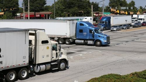 Commercial trucks fill Fulton Industrial Boulevard at Camp Creek Parkway on Monday. Curtis Compton /ccompton@ajc.com