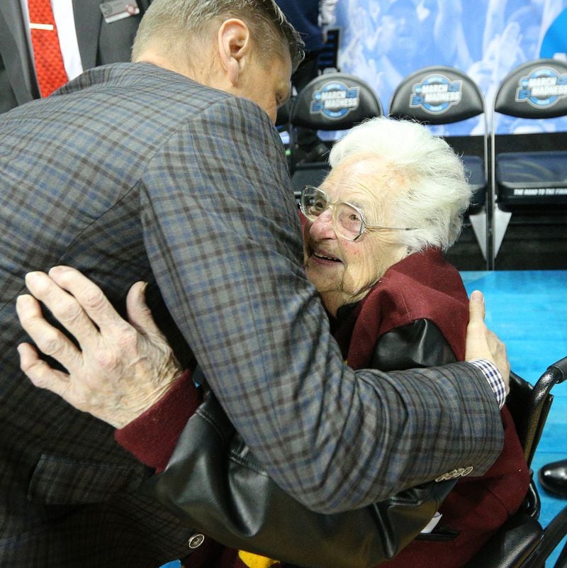 Loyola head coach Porter Moser hugs team chaplain Sister Jean Dolores Schmidt after beating Nevada 69-68 in the NCAA Tournament regional semifinal Thursday, March 22, 2018, at State Farm Arena in Atlanta. (Curtis Compton/ccompton@ajc.com)