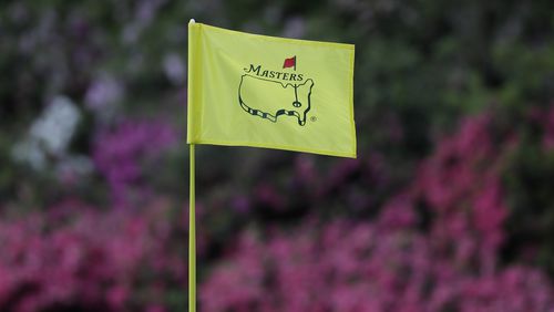 In this April 11, 2019, file photo, the flag on the 13th hole blows in the wind during the first round for the Masters golf tournament in Augusta, Ga. Augusta National decided Friday, March 13, 2020, to postpone the Masters because of the spread of the coronavirus. Club chairman Fred Ridley says he hopes postponing the event puts Augusta National in the best position to host the Masters and its other two events at some later date. Ridley did not say when it would be held.(AP Photo/David J. Phillip, Fil)