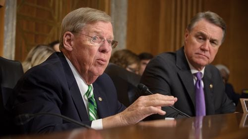 Georgia U.S. Sens. Johnny Isakson, left, and David Perdue were reliable supporters of the GOP tax plan as it moved through the Senate this week. Senate Photography Office